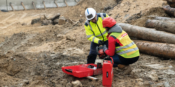 Two men speaking on a construction site